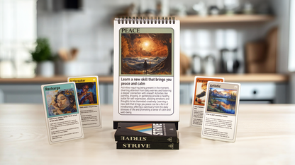 A close-up view of the52-week flip book and activity cards for personal growth. The flip book is open to the "Peace" page with a calming image. Several cards from the deck are spread around it, each featuring unique artwork and prompts related to finding peace and calm. Three packaged activity card decks are stacked in the foreground.